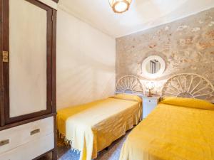 Postel nebo postele na pokoji v ubytování Holiday Home Can Felip by Interhome