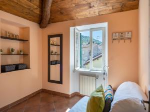 Posteľ alebo postele v izbe v ubytovaní Apartment Ca' du Mou - DOL102 by Interhome