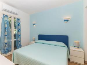 En eller flere senger på et rom på Holiday Home San Pietro Green by Interhome