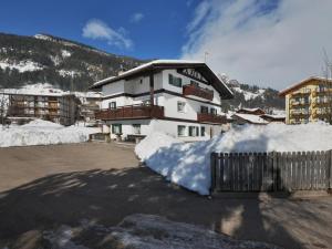 a pile of snow in front of a building at Apartment Cincelli by Interhome in Pozza di Fassa