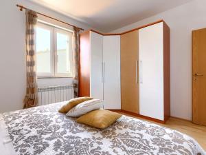 Posteľ alebo postele v izbe v ubytovaní Holiday Home House Eric&Paolo by Interhome
