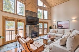 a living room with a couch and a fireplace at Luxury Leadville Getaway with Hot Tub! in Leadville