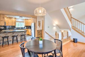 a kitchen and dining room with a table and chairs at Luxury Leadville Getaway with Hot Tub! in Leadville