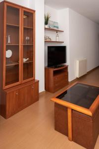 Telewizja i/lub zestaw kina domowego w obiekcie Apartamentos A Laxe