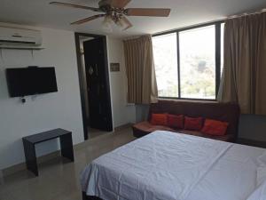 Cama ou camas em um quarto em Acogedor apartamento con excelente vista al mar.