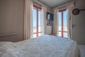 A bed or beds in a room at Helios Selene