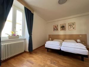 Letto o letti in una camera di Appartamenti Baia Azzurra 4.