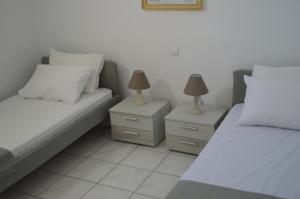 Postel nebo postele na pokoji v ubytování Revel Mykonos 6