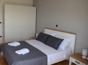 Posteľ alebo postele v izbe v ubytovaní Apartman Oneum