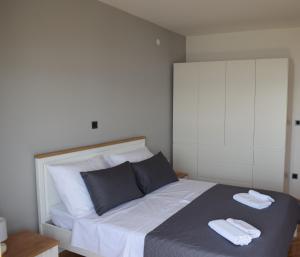 Posteľ alebo postele v izbe v ubytovaní Apartman Oneum