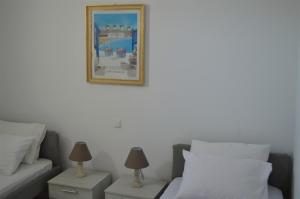 Postel nebo postele na pokoji v ubytování Revel Mykonos 6