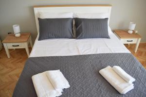 Posteľ alebo postele v izbe v ubytovaní Apartman Oneum