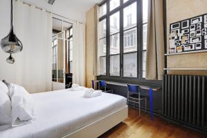Posteľ alebo postele v izbe v ubytovaní Pick A Flat's Apartment in Upper Marais - Rue d'Hauteville