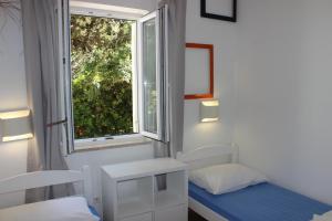 Postel nebo postele na pokoji v ubytování Apartments Blue Sea
