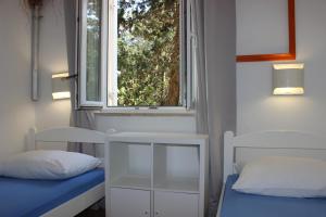 Postel nebo postele na pokoji v ubytování Apartments Blue Sea