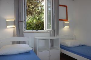 Postel nebo postele na pokoji v ubytování Apartments Blue Sea