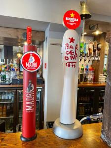a couple of signs on a table in a store at Punch House Monmouth in Monmouth
