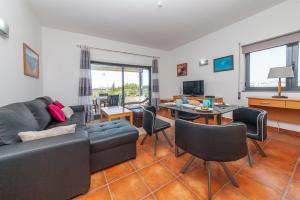 a living room with a couch and a table at A21 - 1 Bed Apartment in MarinaPark in Lagos