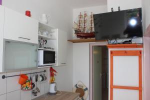 Kuchyň nebo kuchyňský kout v ubytování Apartments Blue Sea