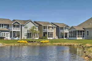 a row of houses with a river in front at 3 Mi to Fenwick Island Beach Luxe Bungalow in Peppers Landing