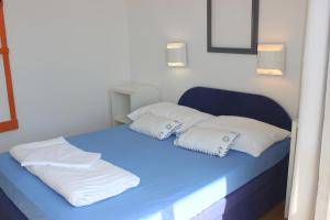 Postel nebo postele na pokoji v ubytování Apartments Blue Sea