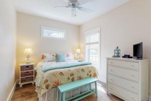 a bedroom with a bed and a tv and a dresser at Wells Wonder in Wells +54 photos