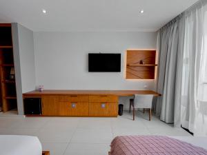 TV a/nebo společenská místnost v ubytování Hotel Puerto Libre