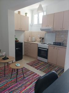 Kuchyň nebo kuchyňský kout v ubytování Sable Blanc Apartments