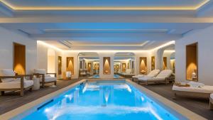 a hotel lobby with a large swimming pool at Black Door in Paris