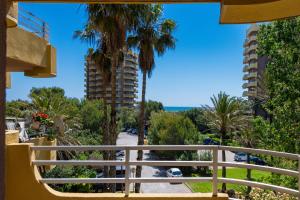 a balcony with a view of the beach and buildings at Salamar Saler Golf in El Saler