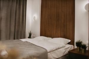 Postel nebo postele na pokoji v ubytování Rajskie Uroczysko Apartamenty Jacuzzi Sauna