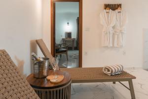 a room with a table and a chair and a mirror at Santuário Hotel Fazenda in Santo André