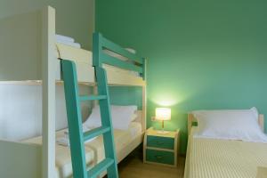 A bed or beds in a room at Ammoudara Bay Villa