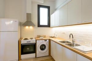 A kitchen or kitchenette at Ammoudara Bay Villa