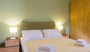 A bed or beds in a room at Ammoudara Bay Villa