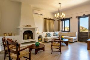 A seating area at Ammoudara Bay Villa