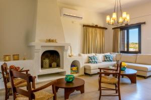 A seating area at Ammoudara Bay Villa