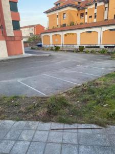 an empty parking lot in front of a building at Apartamento Turistico Valdellera IV in Posada de Llanes