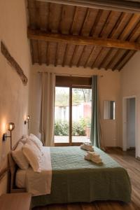Postel nebo postele na pokoji v ubytování Agriturismo L'Aquilone