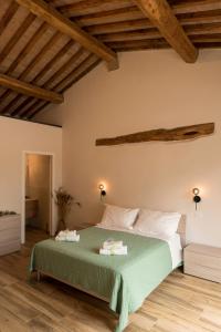 Ένα ή περισσότερα κρεβάτια σε δωμάτιο στο Agriturismo L'Aquilone
