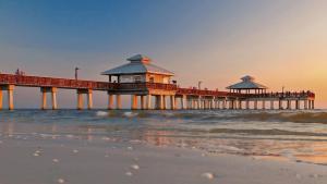 a pier on the beach with the ocean at !NEW! Villa Violina in Cape Coral