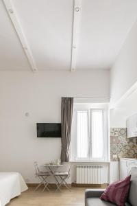TV a/nebo společenská místnost v ubytování Mare all'Arco Casa Vacanze