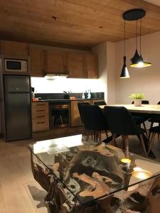 Kuchyň nebo kuchyňský kout v ubytování Cocoonabay Appartements