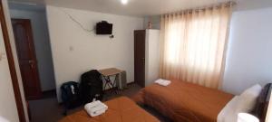 Postel nebo postele na pokoji v ubytování Pukara House