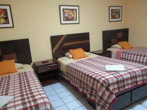 Postel nebo postele na pokoji v ubytování Kurmi Hostel Lima Airport