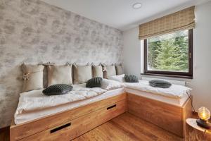 Posteľ alebo postele v izbe v ubytovaní Apartment Adélka 106 Špindlerův Mlýn