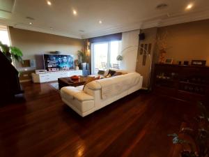 A seating area at HHC - Holidays House Compostela