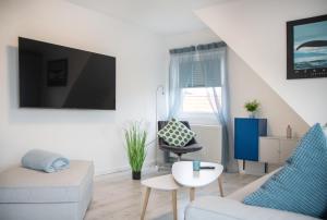 TV a/nebo společenská místnost v ubytování Friesenstraße 13