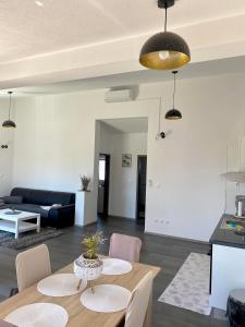 a living room with a table and a couch at Apartman Ritta in Biograd na Moru