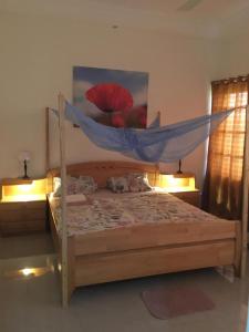 Кровать или кровати в номере Villa Cocotiers A11